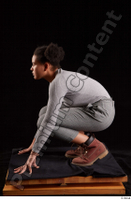  Zahara  1 brown workers dressed grey sweatshirt grey trousers kneeling whole body 0003.jpg